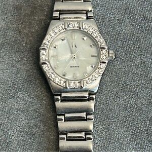 Quartz silver-tone stainless steel crystal rhinestone round face watch